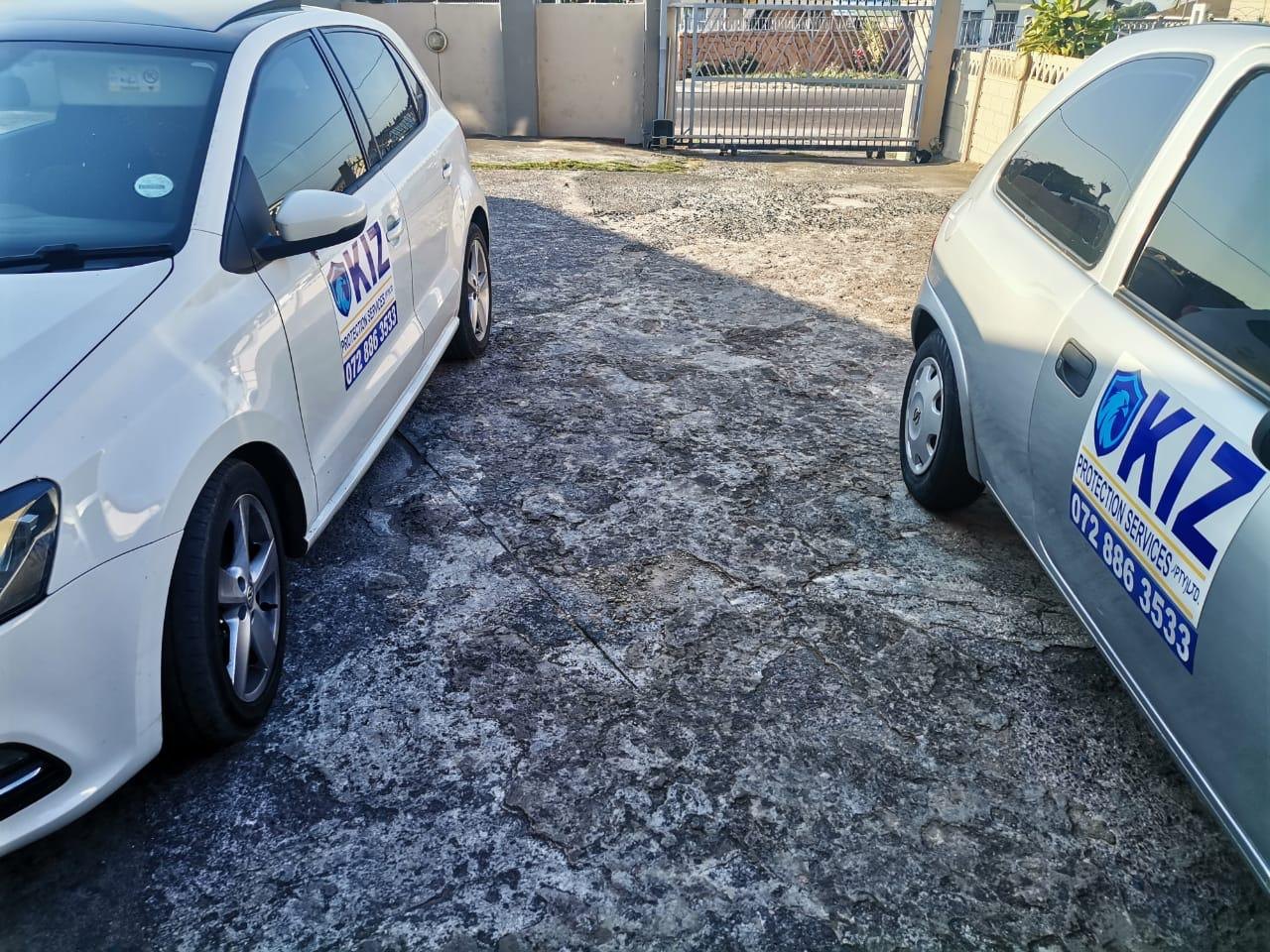 Close-up of branded KIZ security vehicles